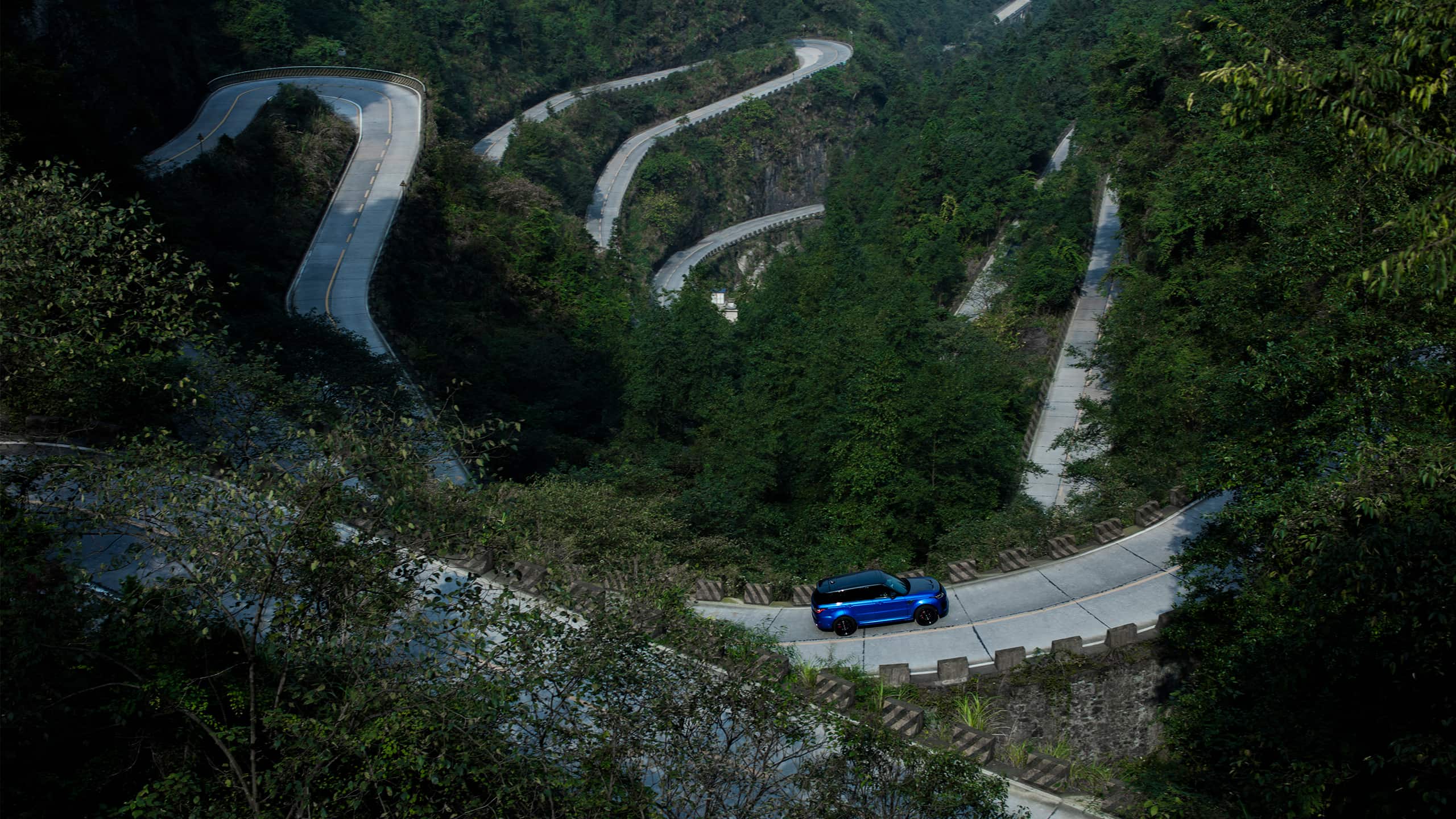 Range Rover drive crosses the Hill road